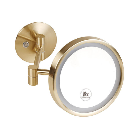 Gold wall-mounted magnifying mirror with a circular lighted face and adjustable bracket, shown on a plain white background.
