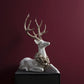 Resting White Deer with Laurel Wreath